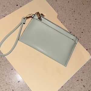 A new day light green wristlet